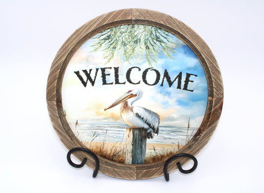 Pelican "Welcome" Round Wood Framed Artwork